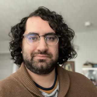 A headshot of Ethan Rivera