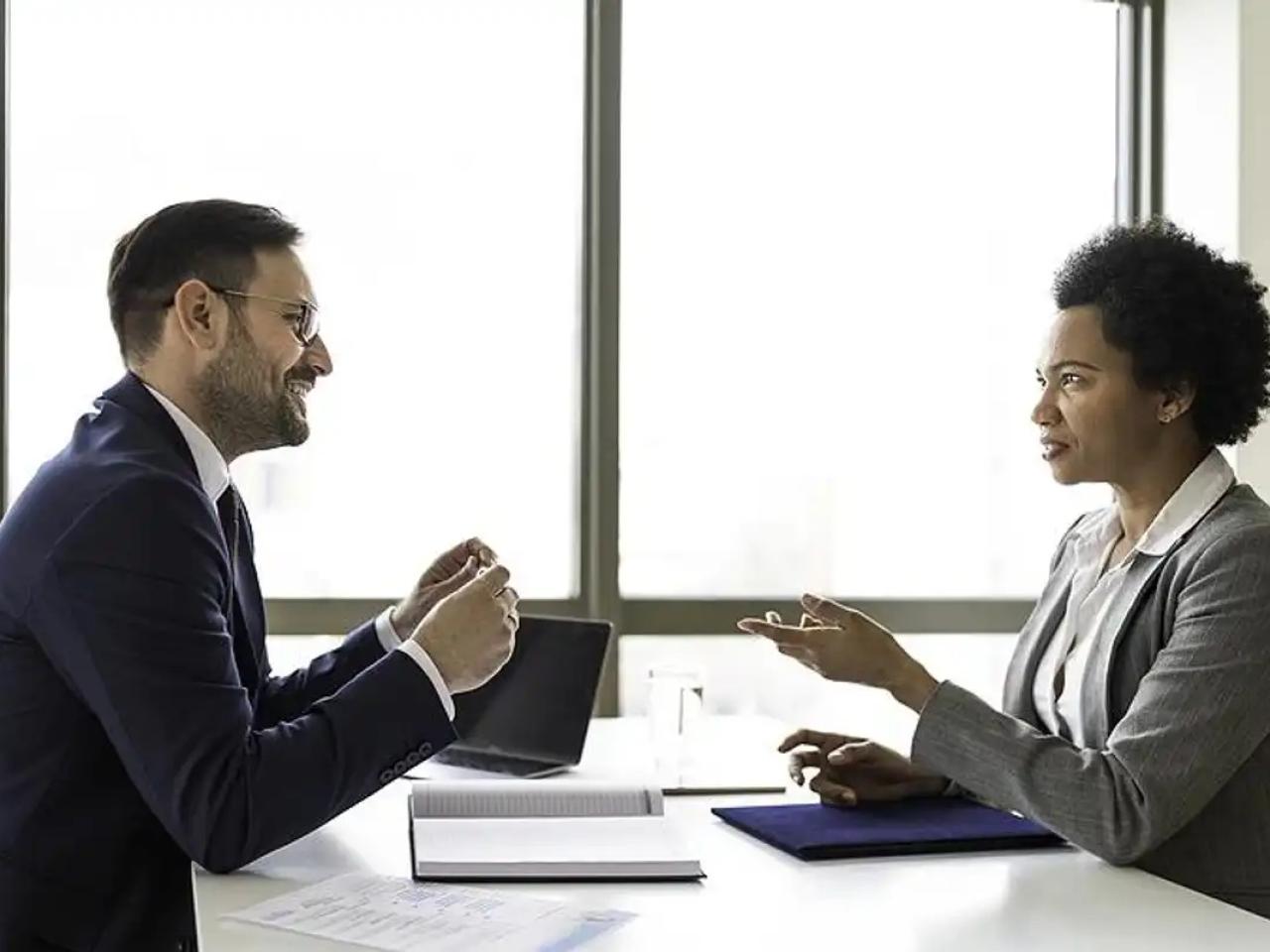 Woman asks a question during a job interview
