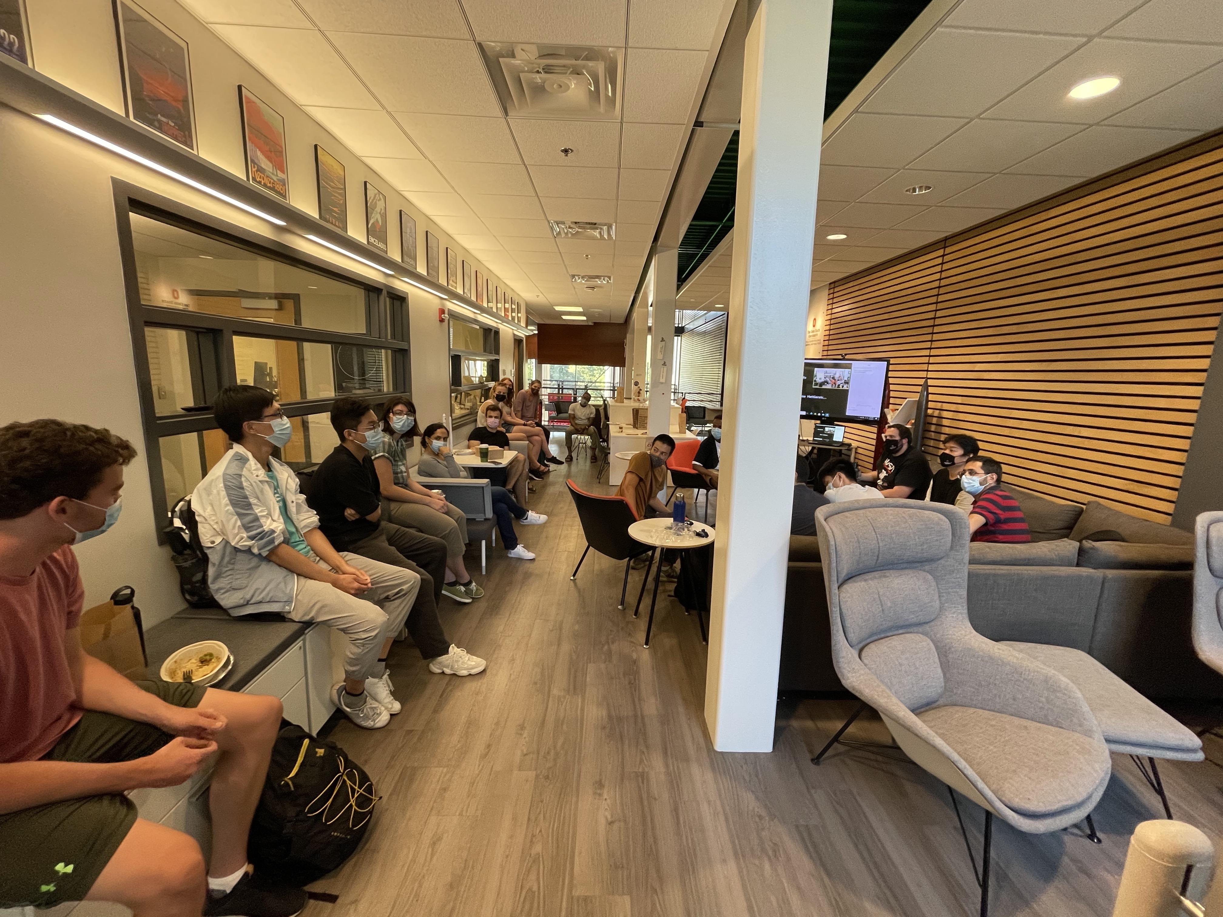 A view of Battelle Center in Page Hall with students gathered and speaking