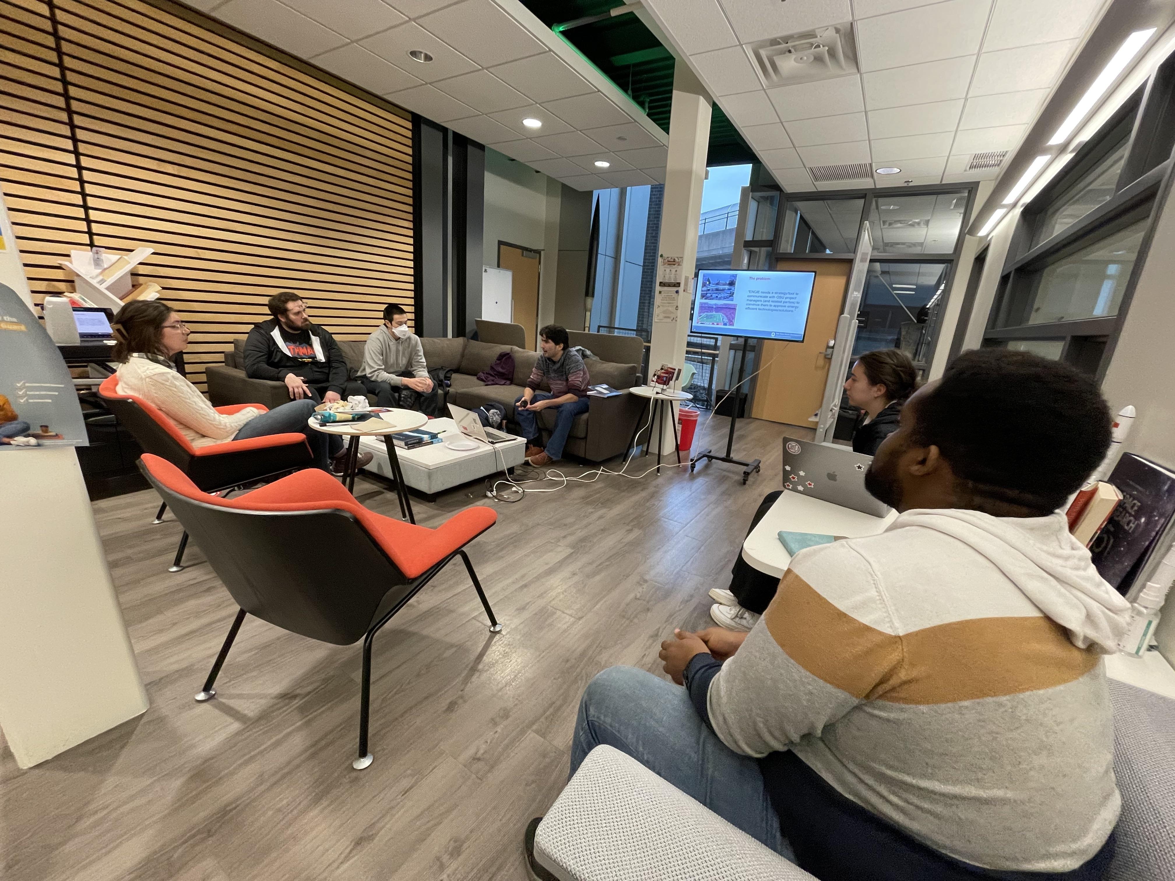 Students gathered around a presentation