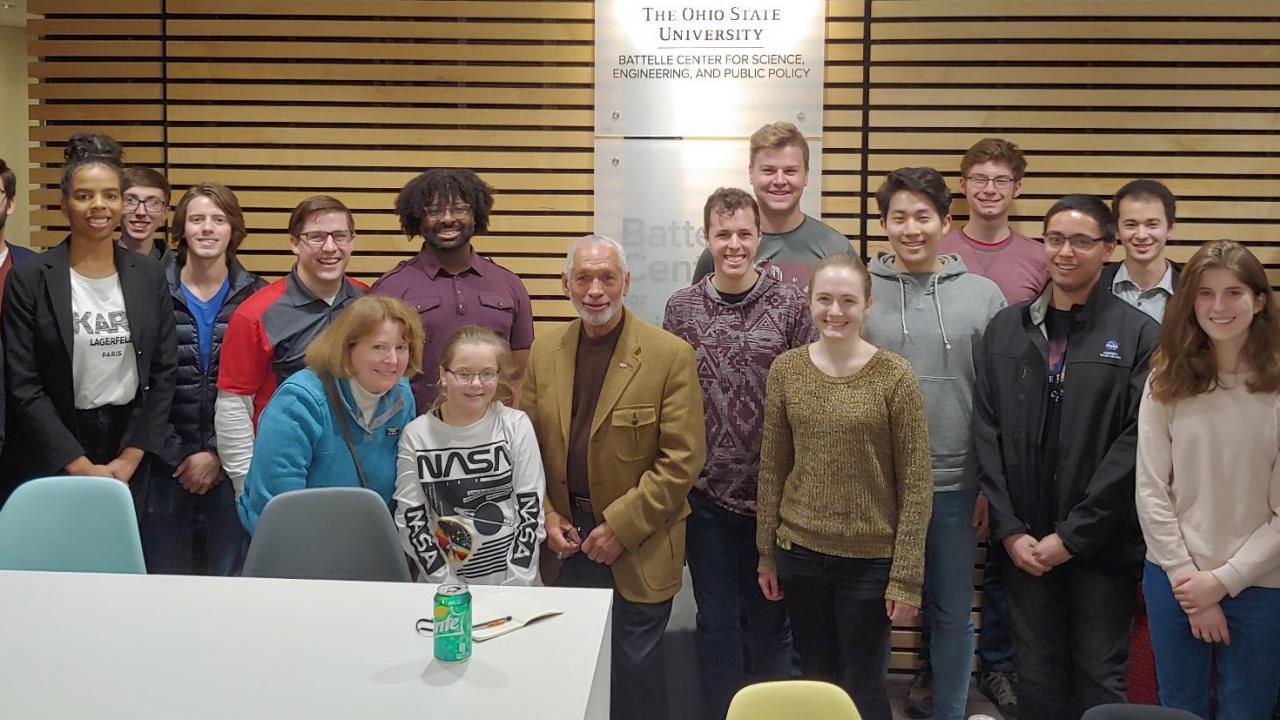 A group of students gathered with Charlie Bolden